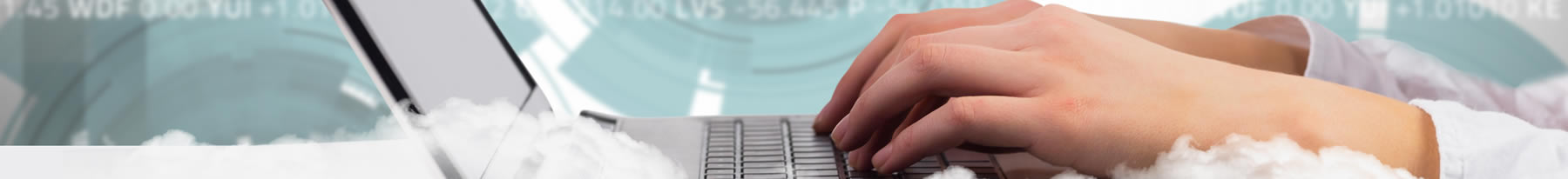 woman's hands typing on laptop